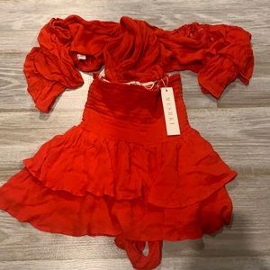 Two piece MESHKI red Etta set. Tie front crop top with flowy skirt. Small
